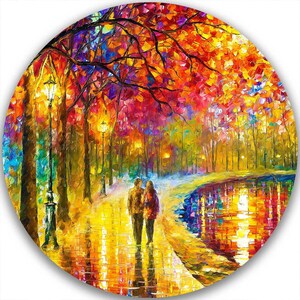 May include: A vibrant, circular painting depicts a couple walking on a path in a park. The scene is illuminated by streetlights and features colorful trees with red, orange, and yellow leaves. The path reflects the warm light.