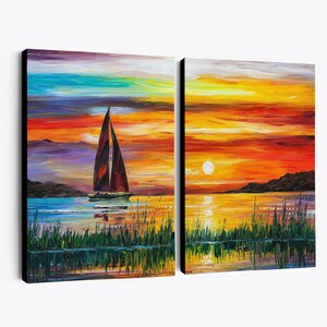 May include: A two-panel canvas art piece depicting a sunset over a lake. The left panel shows a sailboat with a brown sail, while the right panel features the sun setting over the water. The sky is a mix of orange, yellow, and purple hues.