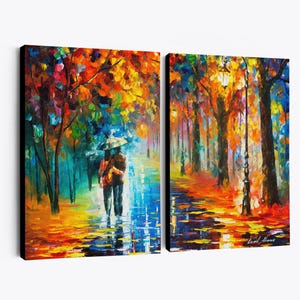 May include: A two-panel canvas art print depicting a vibrant autumn scene. The artwork features a couple walking under an umbrella on a wet path, surrounded by colorful trees. The style is impressionistic, with bold brushstrokes and a rich palette of reds, oranges, and blues.