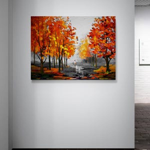May include: An oil painting depicts a park scene with vibrant orange and yellow trees lining a path. A figure walks along the path, which reflects the sky. The artwork is dominated by warm colors, creating a sense of autumn.