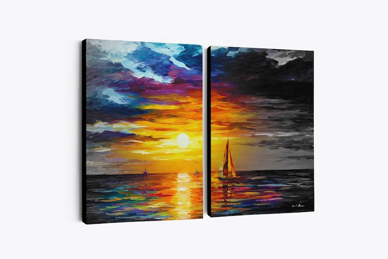 May include: A two-panel canvas art piece depicting a sunset over the ocean. The left panel shows a vibrant sunset with orange, yellow, blue, and purple hues. The right panel is a grayscale version of the same scene, with a sailboat.