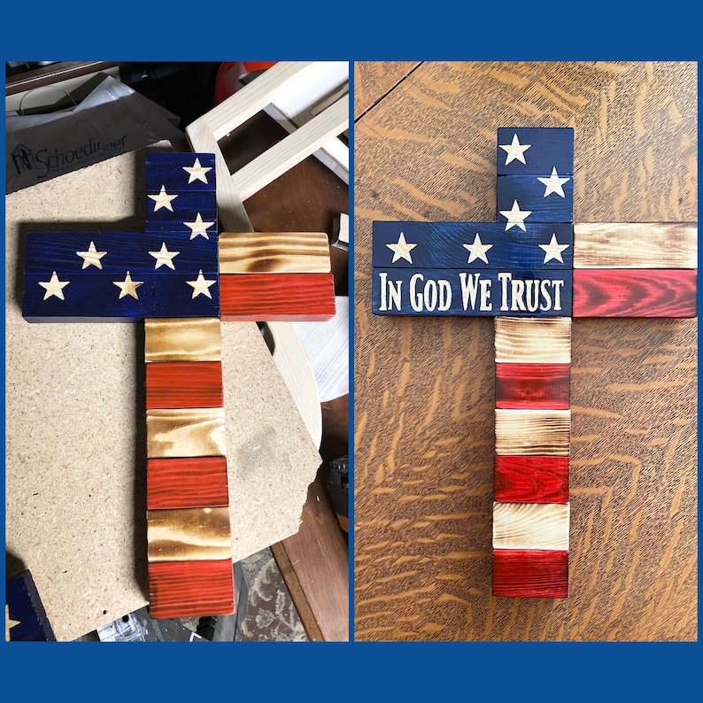 K&ouml;nnte beinhalten: Ein Holzkreuz, das mit der amerikanischen Flagge verziert ist. Das Kreuz besteht aus einzelnen Holzbrettern, die in Rot, Wei&szlig; und Blau gestrichen sind. Die Oberseite des Kreuzes zeigt das blaue Feld der Flagge mit wei&szlig;en Sternen. Die Unterseite des Kreuzes zeigt die roten und wei&szlig;en Streifen der Flagge. Das Kreuz tr&auml;gt auch die Worte "In God We Trust" auf sich.