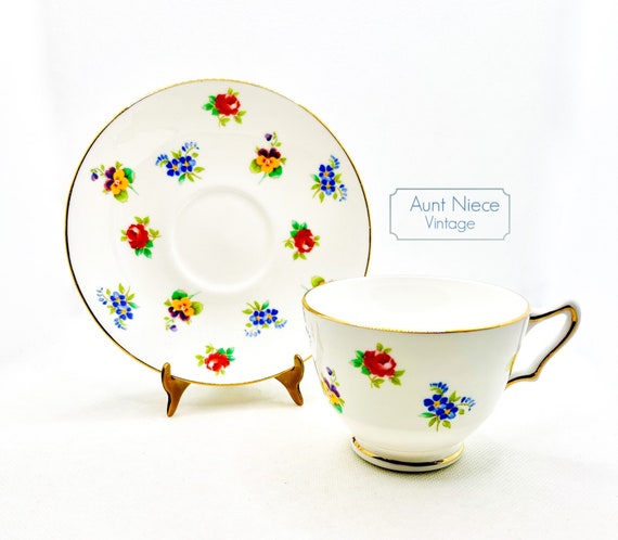 Vintage Teacup and Saucer Crown Staffordshire bone china small flowers tiny floral on white with gold accents pink, blue and yellow c.1940s