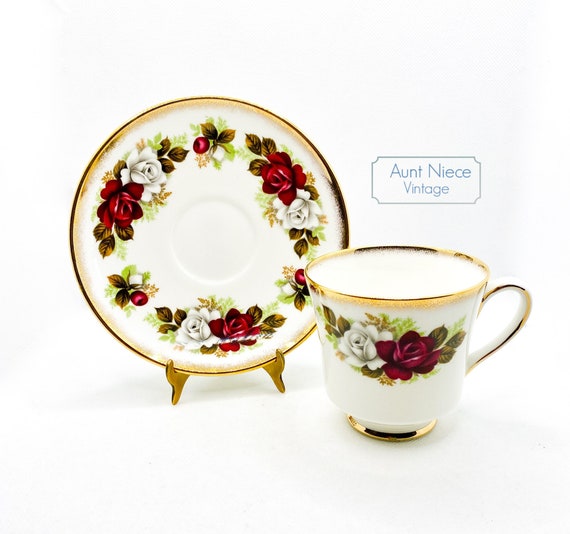 1960's vintage Royal Tuscan Red and White Roses, green leaves and heavy gold gilt cup and saucer