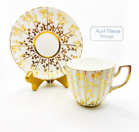1950s Vintage Grosvenor gold leaves on white with decorative handle teacup and saucer