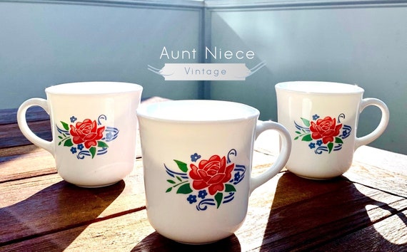 Sets and single Vintage Mugs Corning Summer Fair red rose and blue floral coffee cup c. 1980s