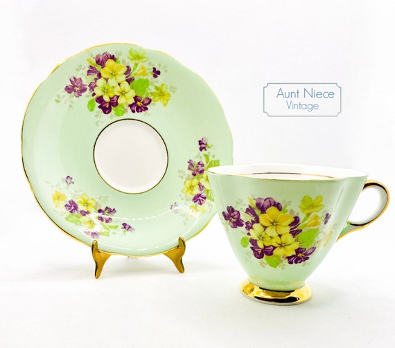 1950's vintage Clarence Bone China Green with yellow and purple floral pansies vintage teacup and saucer