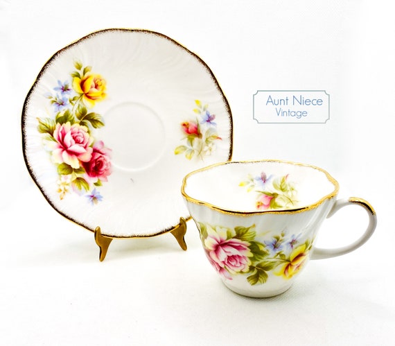Vintage Royal Heritage teacup and saucer Pink and Yellow Roses with Blue floral and heavy gold gilt dainty cup saucer c.1960s