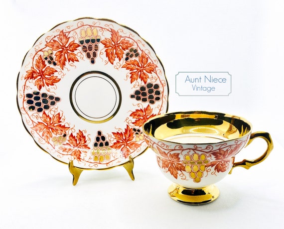 Vintage Teacup Saucer Rosina China Orange Red Gold Grapes leaves gold rim pedestal cup and saucer c. 1940s