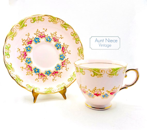 Vintage pink teacup and saucer Tuscan Bone China Pink, green and Gold with blue floral cup and saucer c.1950's