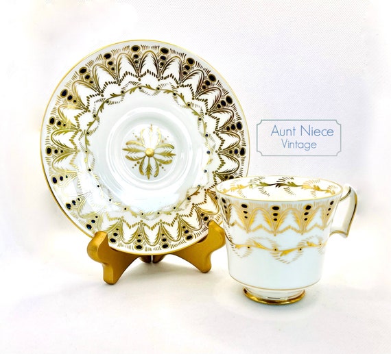 Vintage Teacup and Saucer by Royal Chelsea bone china cup saucer with ornate gold and navy blue accents c. 1950s