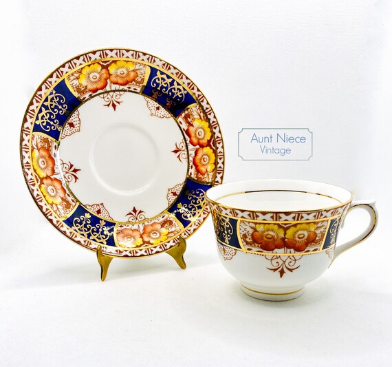 1940s Colclough bright gold guilt orange flowers and navy cup saucer