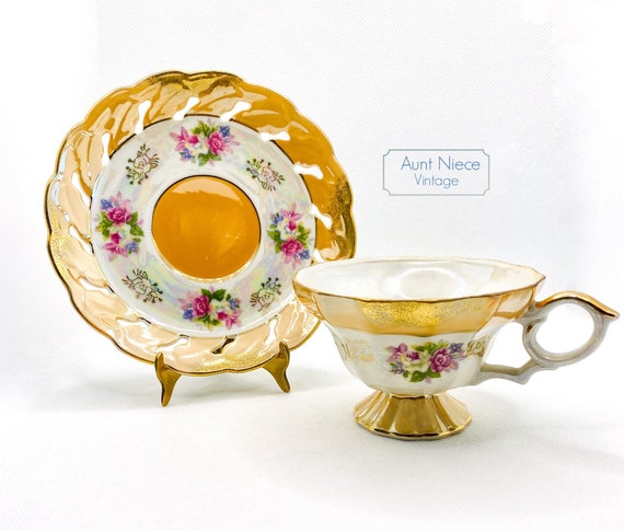 Vintage Norcrest Gold and Floral pedestal teacup with ornate saucer