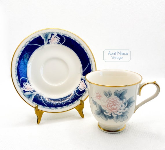 Vintage Demitasse Noritake Ivory China Night Song navy blue band pink and white floral espresso cup and saucer c. 1980s