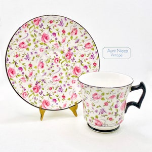 1960&#39;s Royal Chelsea Pink Roses and Purple Floral Chintz Black Handle vintage teacup and saucer