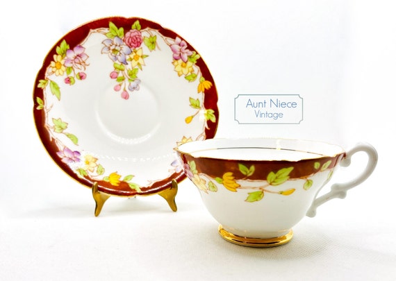 Vintage teacup and saucer Stanley bone china brown wide mouth pedestal cup with yellow pink and purple flowers gold accent c.1950s
