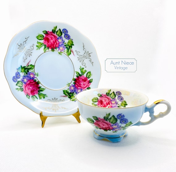 Vintage Teacup and Saucer with ornate handle pale blue pink cabbage roses and purple floral w gold accents Pedestal teacup lustreware