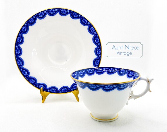 Antique Royal Worcester Teacup and Saucer blue floral rim on white with gold gilt accent c.1905