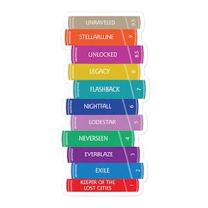 May include: A stack of ten colorful books with the titles "Keeper of the Lost Cities", "Exile", "Everblaze", "Neverseen", "Lodestar", "Nightfall", "Flashback", "Legacy", "Unlocked", and "Stellarlune". The books are numbered 1 through 10.