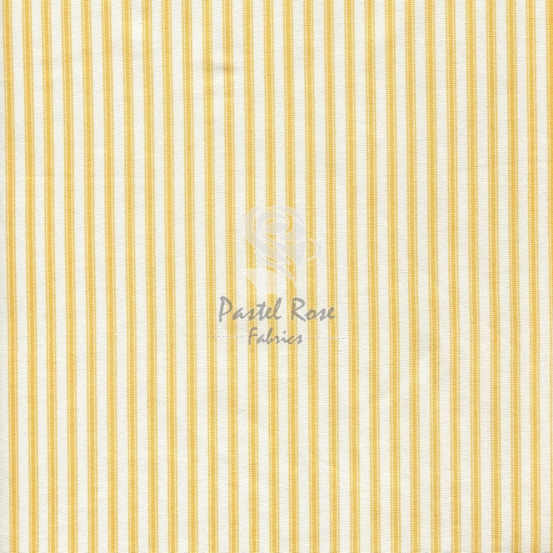 May include: Yellow and white striped fabric with a subtle texture. The fabric is woven with thin yellow stripes on a white background.