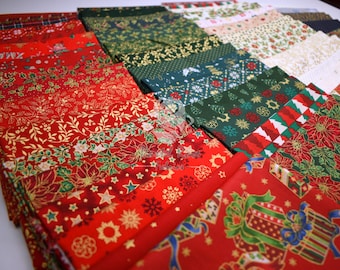 May include: A collection of folded fabric pieces featuring various Christmas-themed patterns in red, green, white, and gold. The designs include poinsettias, snowflakes, stars, holly leaves, and gift boxes. A faint watermark is visible in the center.