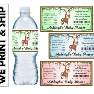 May include: A green, blue, and pink printable water bottle label with a cartoon monkey hanging from a tree branch. The label says "Ashleigh's Baby Shower" and includes the date "October 22, 2011".