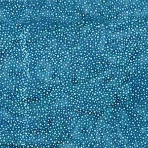 May include: A fabric with a blue background covered in small white dots. The dots vary in size and density, creating a textured appearance. The overall effect is a pattern reminiscent of a starry night or a speckled surface.