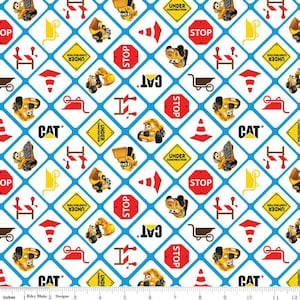 May include: A white fabric with a blue grid pattern featuring repeating images of yellow construction vehicles, traffic signs, and construction cones. The signs include "STOP", "UNDER CONSTRUCTION", and "CAT".