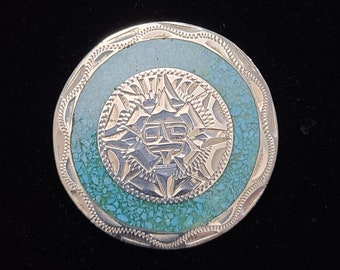Handmade in Guadalajara, Mexico Aztec Sun God Silver and Crushed Turquoise Inlay Pendant/Pin (c 1980)