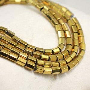 Guldfärgade hematitpärlor i tubform, 6x4,5 mm, 1 sträng 65 st / HBY-003