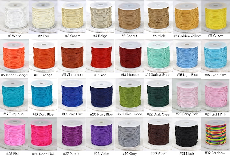 May include: Thirty-two spools of waxed cotton cord in a variety of colours, including white, cream, beige, peanut, mink, golden yellow, yellow, neon orange, orange, cinnamon, red, maroon, spring green, light blue, cyan blue, turquoise, dark blue, saxe blue, navy blue, olive green, dark green, baby pink, light pink, pink, neon pink, purple, violet, grey, brown, black, and rainbow.