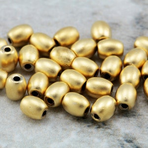 Perline ovali da 5 mm, mini perline distanziatrici in metallo placcato oro opaco/lucido 25 pezzi / GPY-092