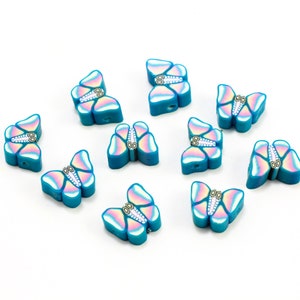 Blue Butterflies made with polymer clay, also known as fimo. These fimo beads are 10mm size with 1.5mm hole. Usable for making bracelets, necklaces and earrings. Mostly using for phone jewelry and, craft project for kids.