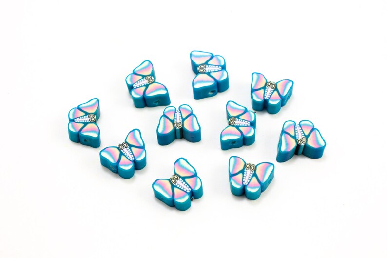 Blue Butterflies made with polymer clay, also known as fimo. These fimo beads are 10mm size with 1.5mm hole. Usable for making bracelets, necklaces and earrings. Mostly using for phone jewelry and, craft project for kids.