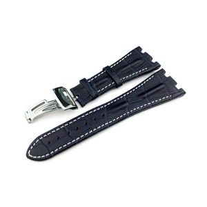 May include: A dark blue leather watch strap with white stitching and a silver buckle.