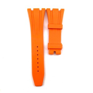 May include: Orange rubber watch strap with a buckle. The strap is designed for a watch with a lug width of 22mm.