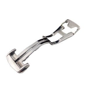 May include: A silver metal watch band clasp with a polished finish.