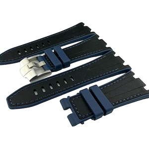 May include: Three blue and black watch straps with a silver buckle. The straps have a textured design and are made of rubber.