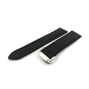 May include: Black watch strap with a textured finish. The strap is made of a durable material and features a silver clasp. The strap is designed to attach to a watch face. The strap is shown on a white background.