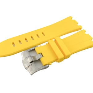 May include: A yellow rubber watch strap with a silver buckle. The strap has a textured surface and is designed for a watch with a lug width of 22mm.