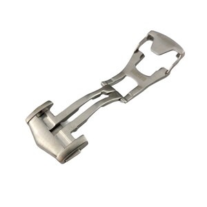 May include: A silver metal watch band clasp with a push-button release.