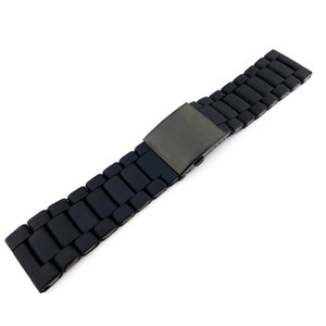 May include: A black metal watch strap with a brushed finish and a clasp.