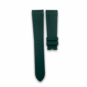 May include: A dark green rubber watch strap with a buckle.