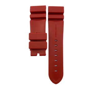 May include: A red rubber watch strap with the text "Swiss Made" printed on the strap.