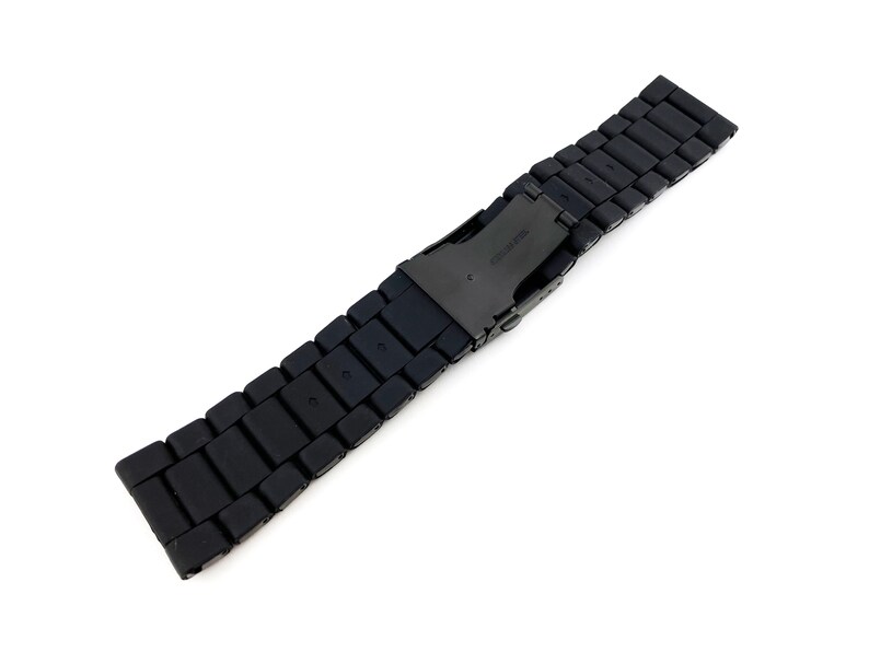 May include: Black metal watch strap with a clasp.