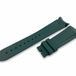 May include: A dark green rubber watch strap with a buckle. The strap is designed for a watch with a 20mm lug width.