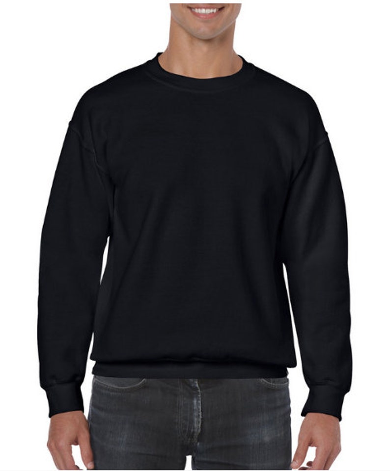 May include: A black crew neck sweatshirt with long sleeves and a ribbed hem.