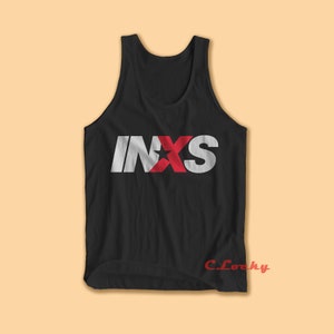 May include: Black sleeveless tank top with a white "INXS" logo with a red star in the middle of the "X".