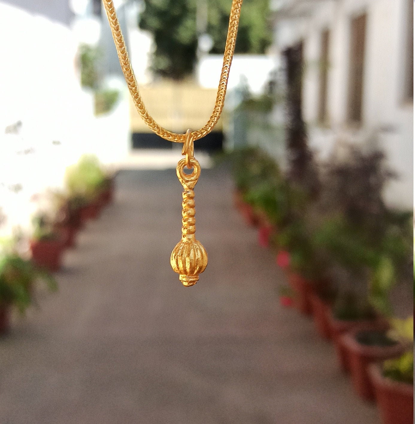 Gold gada locket new arrivals