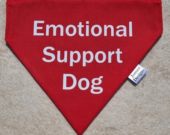 May include: Red bandana with white text that reads "Emotional Support Dog" and a white tag that reads "Jomeo Designs".